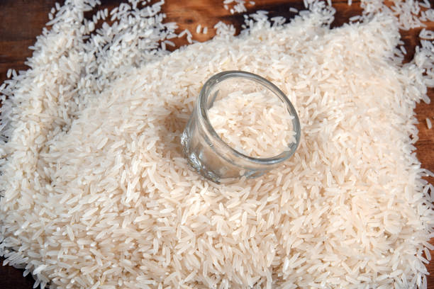 istock white rice natural long rice grain on wooden table use texture background 1483063438