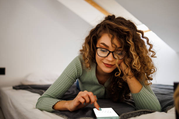 istock Young lady enjoy surfing the net in her cozy attic 1483066723