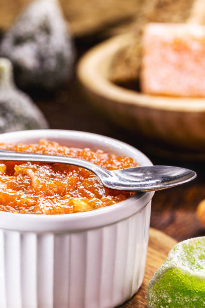 istock pot with homemade pumpkin pudding in a rustic setting, other Brazilian sweets in the background, typical food of the June festivities 1483067055