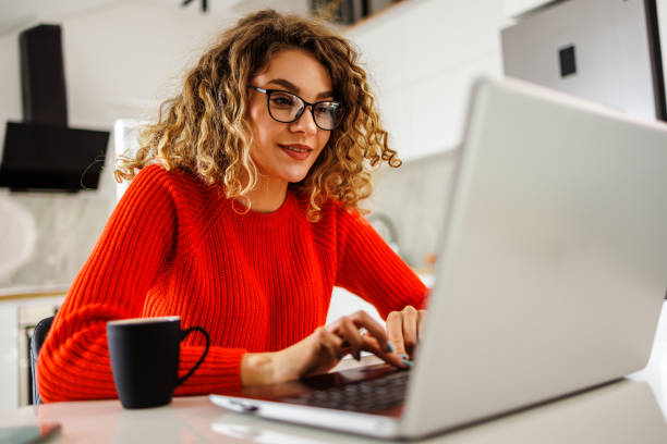 istock Businesswoman works online from kitchen 1483067339
