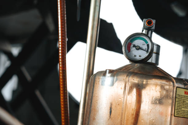 istock Air suction oil drainage device in car service 1483069131