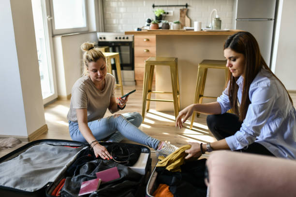 istock Artificial Intelligence Helping Lesbian Couple Pack For Vacation Trip 1483069243