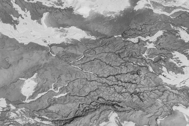 istock The structure of cracked wet earth at the bottom of the lake, creating irregular patterns, structure, background. Amazing shapes created by nature at the bottom of a lake where there is no water 1483069365