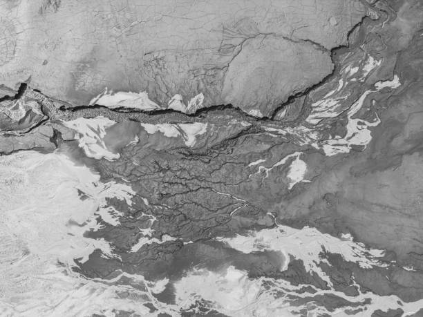 istock The structure of cracked wet earth at the bottom of the lake, creating irregular patterns, structure, background. Amazing shapes created by nature at the bottom of a lake where there is no water 1483069574