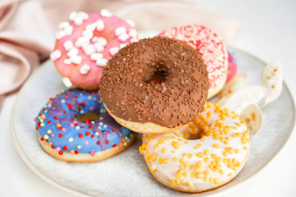 istock Fresh sweet donuts in colorful glaze 1483070112