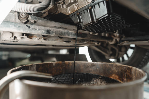 istock Process of oil change in a car service 1483070246