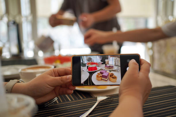 istock People taste delicious Dim sum and take photos 1483071560