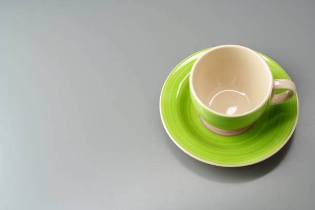istock Top view of ceramic cup with saucer on gray background 1483072443