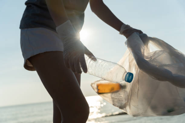 istock Save water. Volunteer pick up trash garbage at the beach and plastic bottles are difficult decompose prevent harm aquatic life. Earth, Environment, Greening planet, reduce global warming, Save world 1483072525