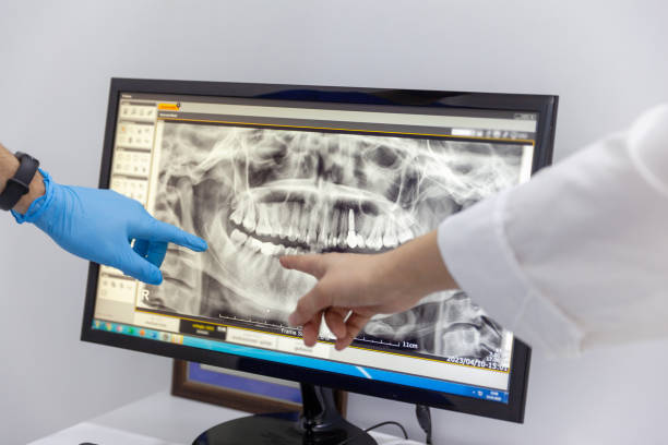 Pointing her mouth x-ray on computer stock photo