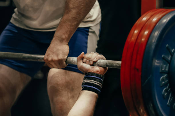 istock hand male powerlifter hold barbell bar before bench press powerlifting competition, power sports games 1483073175