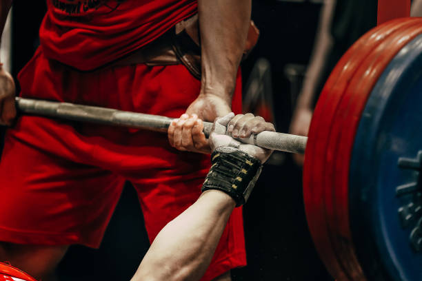 istock bench press powerlifting competition, hand athlete powerlifter hold barbell bar 1483073190
