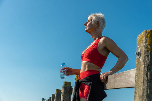 istock Senior Woman Resting after Jogging, looking away 1483074348