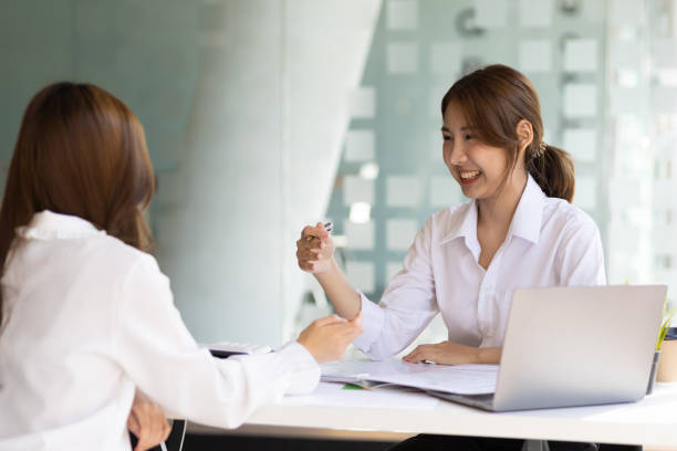 istock Two female colleagues discuss start-up projects and plan corporate strategy. Consultant new startup project idea presentation analyze plan marketing and investment in the office. 1483075024