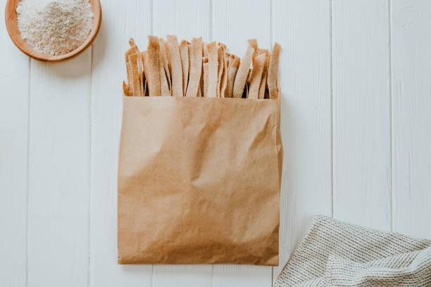 istock Handmade raw pasta pappardelle from whole grain flour on a white table 1483077656