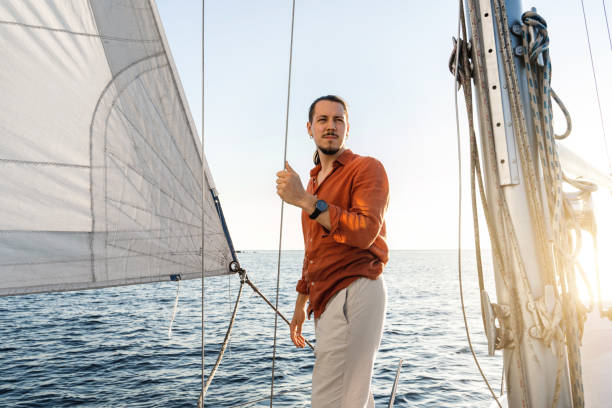istock Young handsome man during on his sailboat during sailing in sea 1483079329