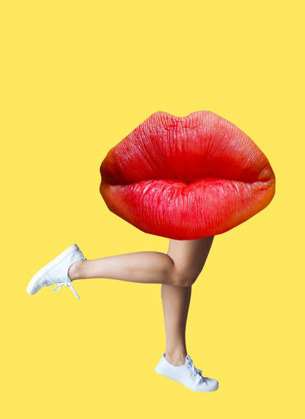 istock A collage of modern art. Female legs with red lips on a yellow background. 1483079491