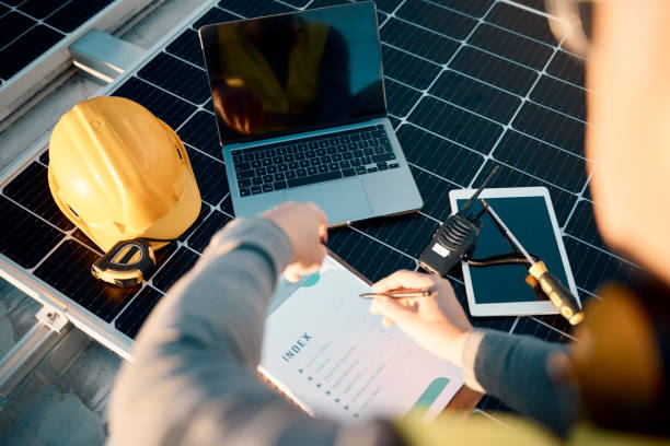 istock Engineer, laptop and man with clipboard, planning and update system with manual, hard hat and fix problems. Male employee, business owner and leader with device, maintenance and upgrade solar panels 1483079669