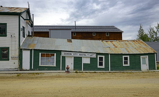 Historic building and traditional wooden building in Dawson City, Yukon Territory, Canada. Klondike gold rush town.