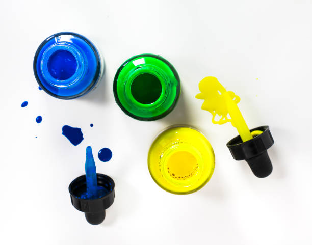 istock Glass bottle with acrylic paint on white background 1483081599