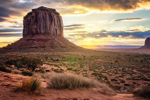 Sun rising in the morning at The Mittens and Merrick Butte in Monument Valley tribal park, Arizona, USA