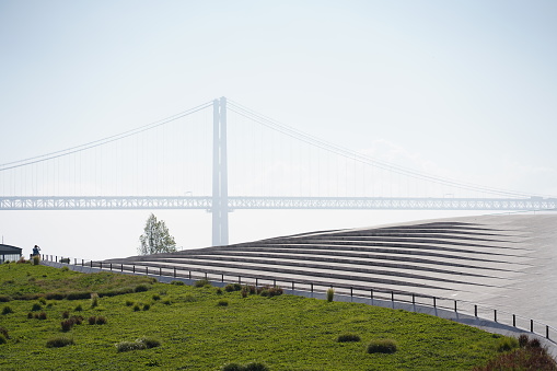 Misty clouds rise above bridge