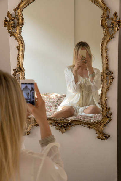 young woman takes selfie in mirror - mirror women baroque style fashion imagens e fotografias de stock
