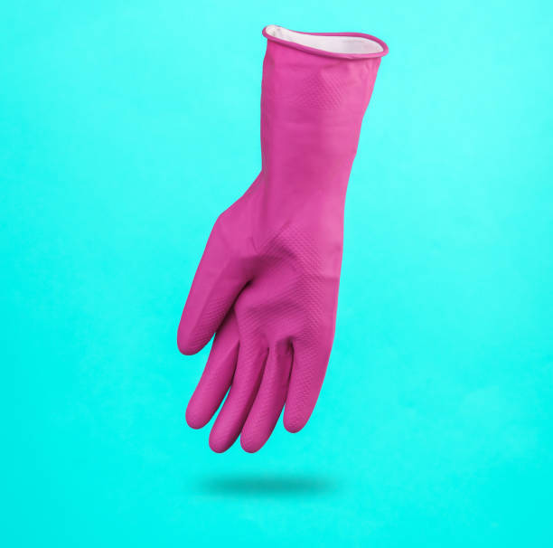 istock Purple cleaning rubber glove levitating on blue background with a shadow. Cleaning concept 1483085857