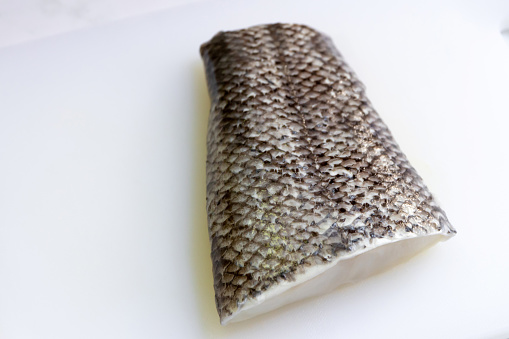 Snow fish tail on cutting board for delicious healthy meal. Snow fish are found in the deep ocean, thick flake and melt-in-your-mouth texture.