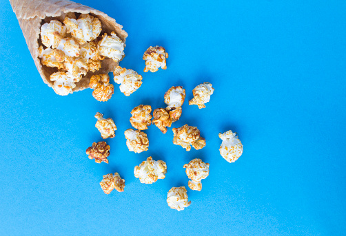 Popcorn on blue colored background