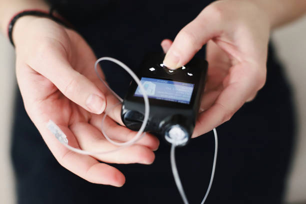 istock Woman holding her insulin pump in hands 1483089277
