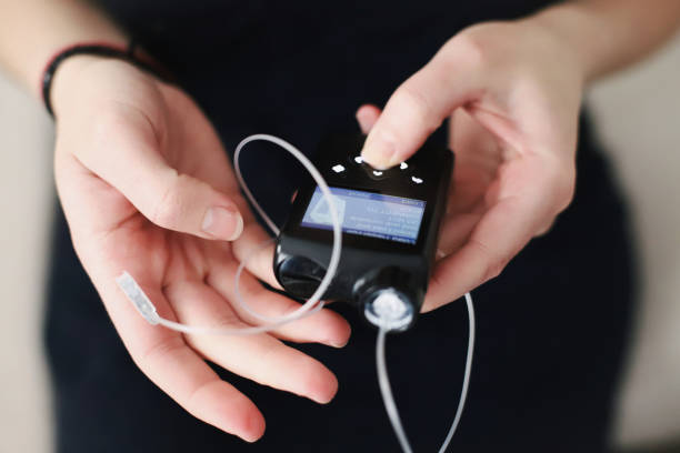 istock Woman holding her insulin pump in hands 1483089289