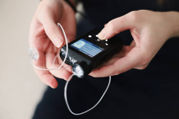 istock Woman holding her insulin pump in hands 1483089303
