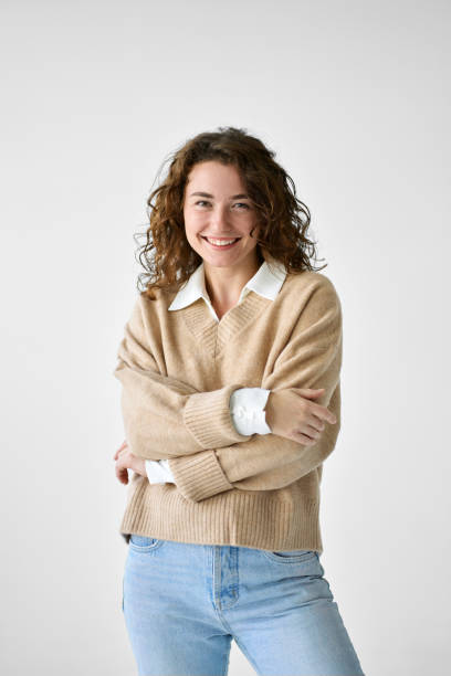 istock Young happy smiling woman standing at white background, vertical portrait. 1483090203