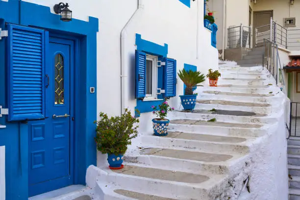 White houses with blue doors and windows in Parga, Greece