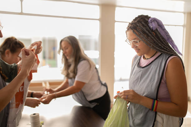 istock Women checking clothing  for second hand donations 1483097135