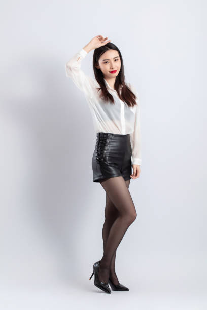 istock Beautiful female model posing in fashion studio 1483097462