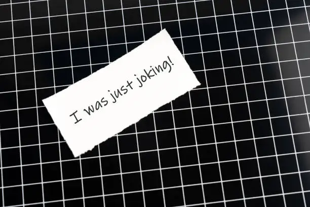 Gaslighting text on adhesive note
