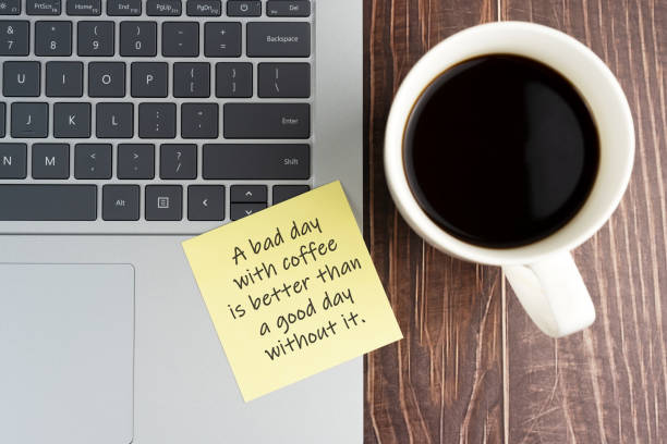 istock Lap top and sticky note of coffee mug with text - A bad day with coffee is better than a good day without it. 1483099266
