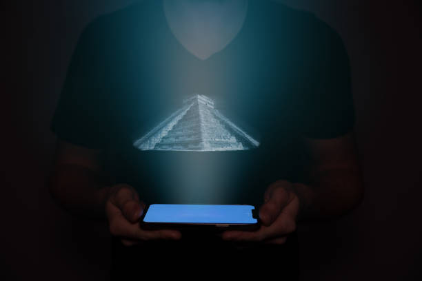 istock An Aztec pyramid is projected from a mobile phone held by a man. Futuristic technology with AI. 1483099415