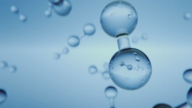 Multiple shiny hydrogen or oxygen gas particles floating slowly in the air. Photorealistic science, medical background 3D animation.