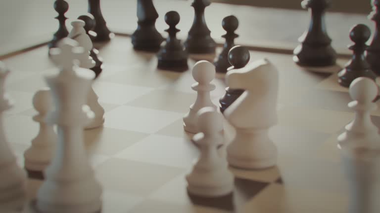 The game of chess. Close-up macro shot of chess pieces on the chessboard. Photorealistic studio shot 3d animation.