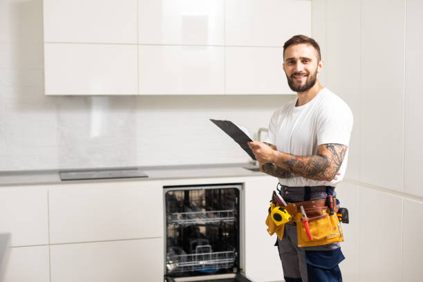 istock Crafts man repairs broken dishwasher 1483103939