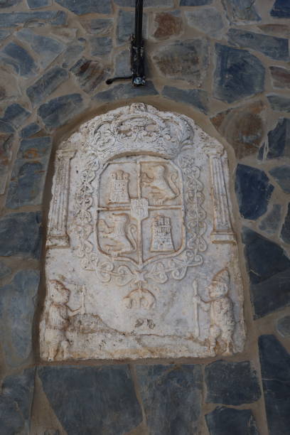 Jabugo, Huelva, Spain, April 13, 2023: Shield on the facade of a house in a street in Jabugo, Huelva, Spain