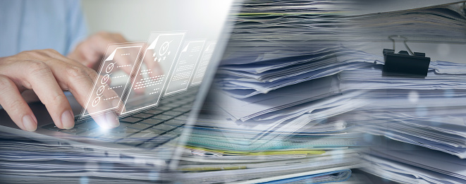 Document Management System (DMS): Businessman digitizes stacks of papers to go paperless. Enterprise Resource Planning (ERP), E-document management, online documentation database, digital file storage