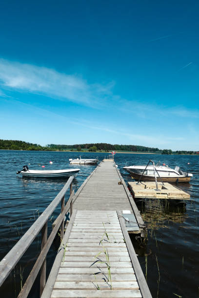 istock some small boats at the jetty in the summer 1483104571