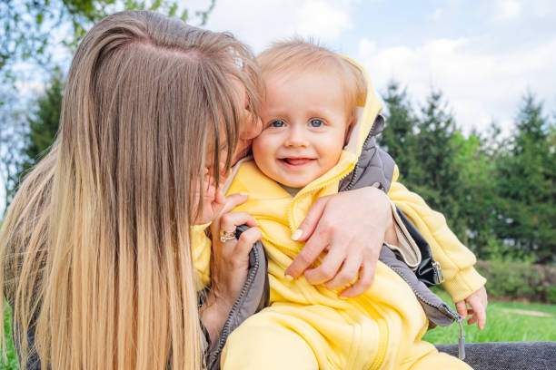 istock Motherly love and warmth shared in a spring park 1483107711