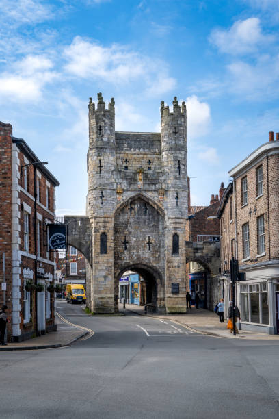 MONK BAR, YORK UK - APRIL 17, 2023. Vertical landscape of the ancient architecture of Monk Bar gate which is a historic structure and part of York city walls