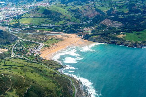 aerial of village Castro Urdiales with playa de dicido, a fine sandy natural beach in Cantabria, Spain