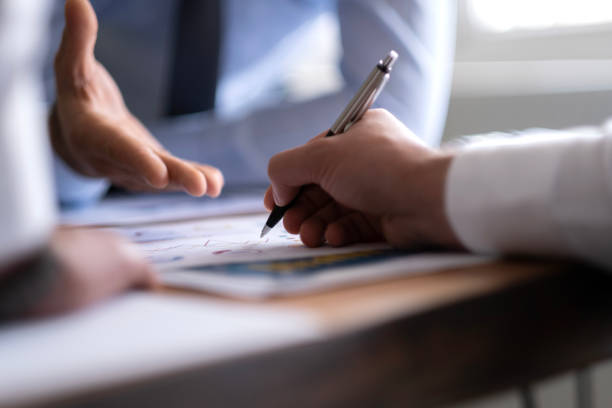 istock Business accounting concept, Business man using calculator with computer laptop, budget and loan paper in office. 1483116294